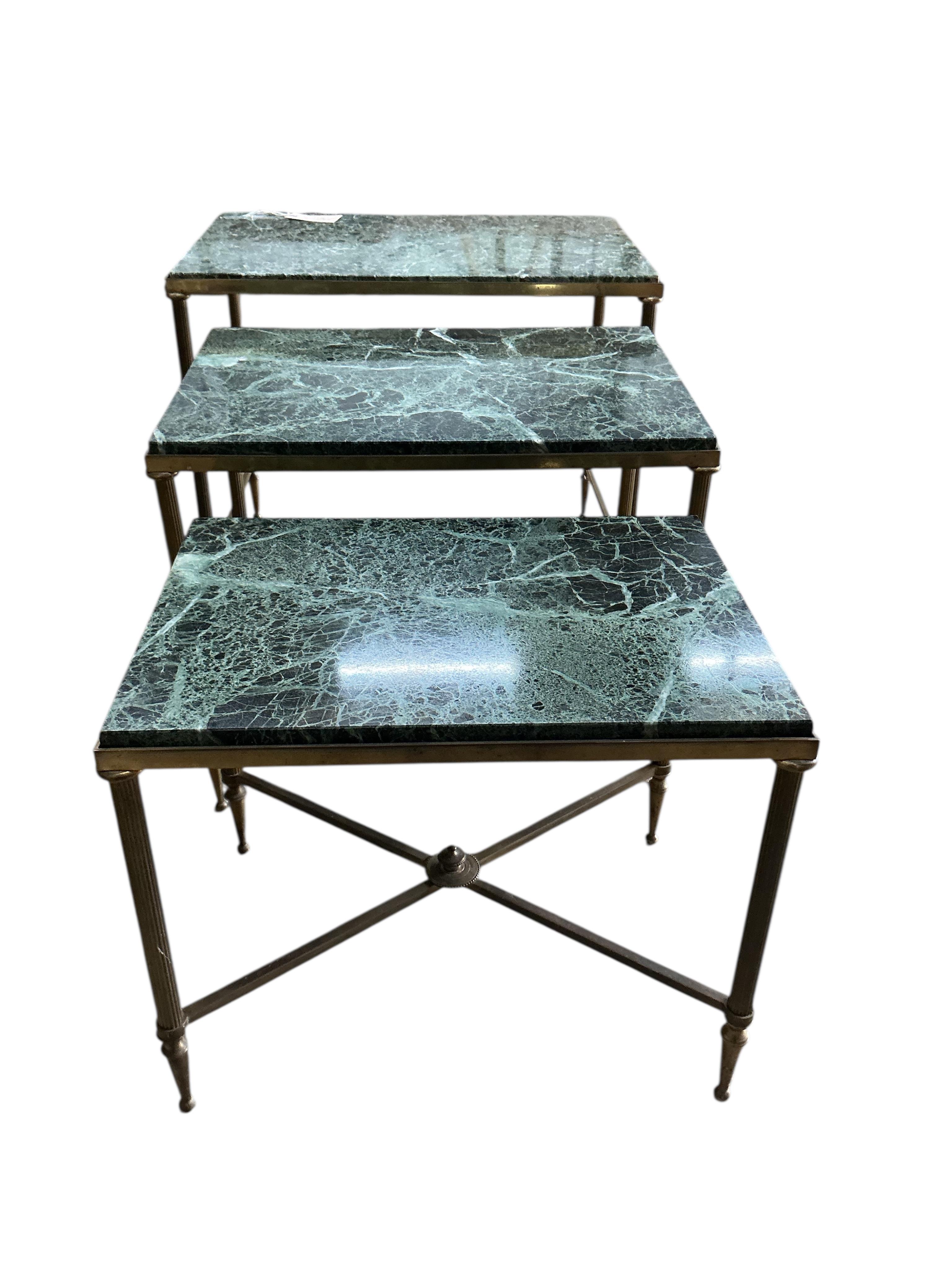 A nest of three Maison Jansen style rectangular brass and marble tables, width 55cm, depth 36cm, height 46cm